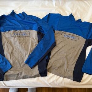 Two kids Rip Curl Rash Vests